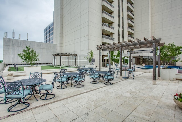 5909 Luther Ln Unit 1700, Dallas, TX 75225 - view of patio / terrace with a pergola and an outdoor pool