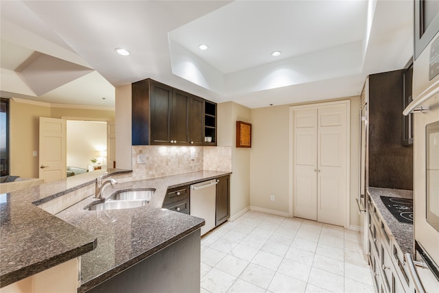 5909 Luther Ln Unit 1700, Dallas, TX 75225 - kitchen featuring a sink, dishwasher, dark brown cabinets, decorative backsplash, and black electric cooktop
