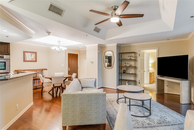 5909 Luther Ln Unit 1700, Dallas, TX 75225 - living area featuring a tray ceiling, wood finished floors, ceiling fan, a chandelier, and baseboards