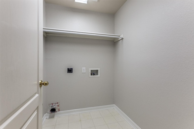 clothes washing area featuring washer hookup, electric dryer hookup, baseboards, and light tile patterned flooring