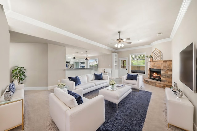 816 Ridgecrest Ct, Aubrey, TX 76227 - living room with ceiling fan, ornamental molding, a stone fireplace, carpet floors, and baseboards