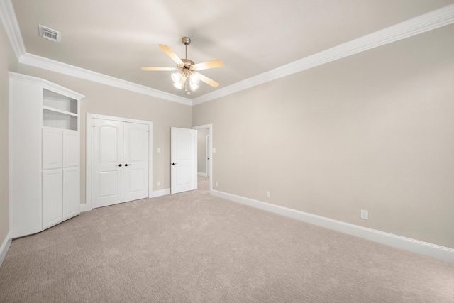 816 Ridgecrest Ct, Aubrey, TX 76227 - unfurnished bedroom with light colored carpet, ornamental molding, baseboards, two closets, and ceiling fan