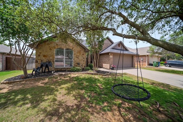 816 Ridgecrest Ct, Aubrey, TX 76227 - view of front of house featuring concrete driveway, stone siding, an attached garage, and brick siding