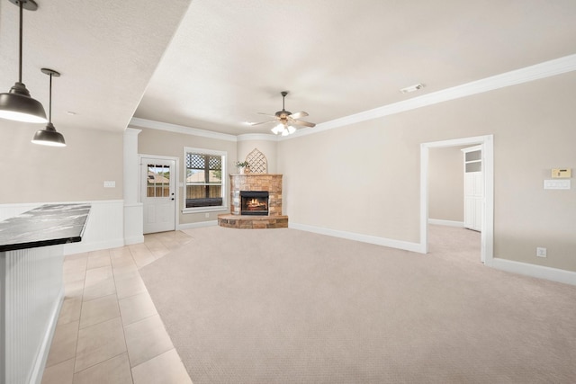 816 Ridgecrest Ct, Aubrey, TX 76227 - unfurnished living room featuring crown molding, ceiling fan, a stone fireplace, baseboards, and light tile patterned flooring