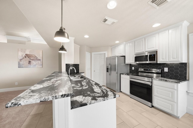 816 Ridgecrest Ct, Aubrey, TX 76227 - kitchen with stainless steel appliances, a peninsula, a sink, white cabinets, and recessed lighting