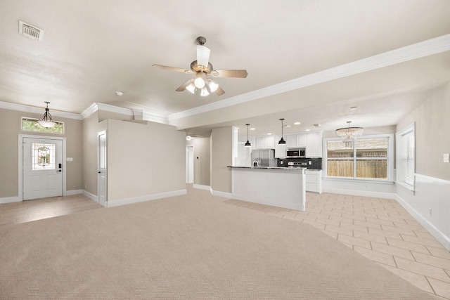 816 Ridgecrest Ct, Aubrey, TX 76227 - unfurnished living room featuring crown molding, light tile patterned flooring, baseboards, a ceiling fan, and a chandelier