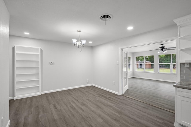 2001 Brenda Ave, Denison, TX 75020 - unfurnished dining area featuring dark wood finished floors, baseboards, recessed lighting, a ceiling fan, and a chandelier