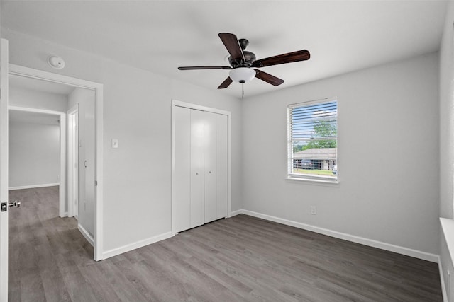2001 Brenda Ave, Denison, TX 75020 - unfurnished bedroom featuring wood finished floors, a closet, baseboards, and ceiling fan