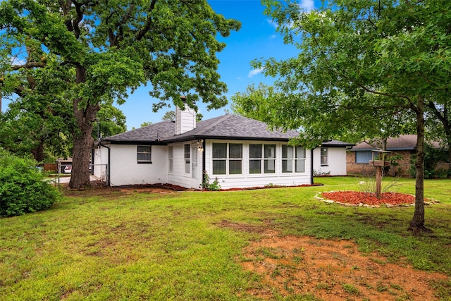 2001 Brenda Ave, Denison, TX 75020 - back of property featuring a chimney and a shingled roof