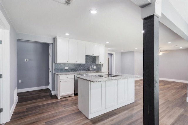 3015 S Fannin Ave, Denison, TX 75021 - kitchen with dishwasher, white cabinets, a sink, dark wood-style flooring, and recessed lighting