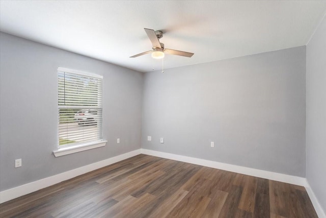 3015 S Fannin Ave, Denison, TX 75021 - spare room featuring ceiling fan, dark wood-style flooring, and baseboards