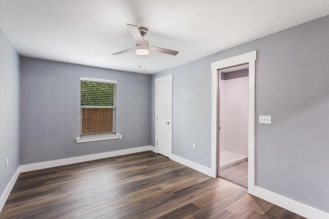 3015 S Fannin Ave, Denison, TX 75021 - unfurnished bedroom featuring dark wood finished floors, baseboards, and a ceiling fan