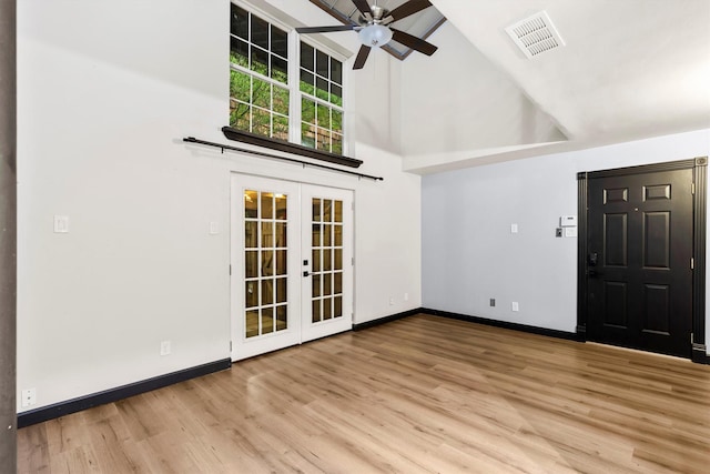 3103 Wycliff Ave, Dallas, TX 75219 - unfurnished living room featuring high vaulted ceiling, french doors, ceiling fan, wood finished floors, and baseboards