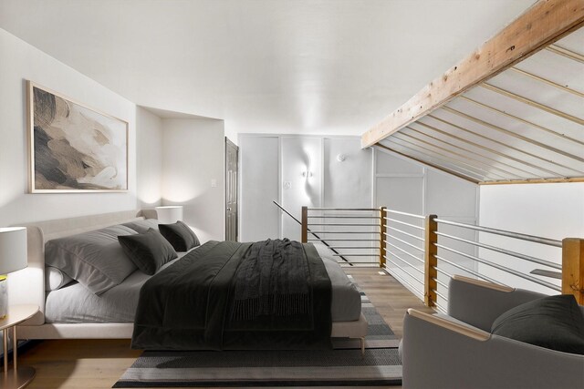 3103 Wycliff Ave, Dallas, TX 75219 - bedroom with wood finished floors and lofted ceiling