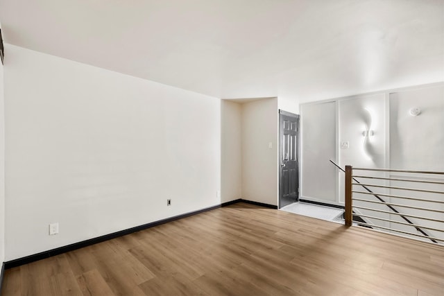 3103 Wycliff Ave, Dallas, TX 75219 - spare room featuring wood finished floors and baseboards