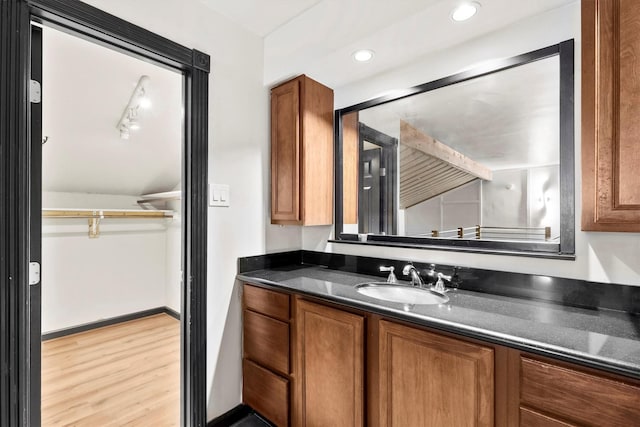 3103 Wycliff Ave, Dallas, TX 75219 - bathroom featuring wood finished floors, vanity, and recessed lighting