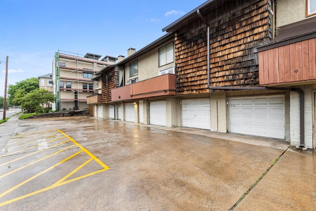 3103 Wycliff Ave, Dallas, TX 75219 - view of building exterior featuring a garage and driveway