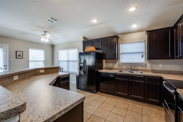 2044 Meadow Park Dr, Princeton, TX 75407 - kitchen with black appliances, a sink, ceiling fan, light tile patterned flooring, and light countertops