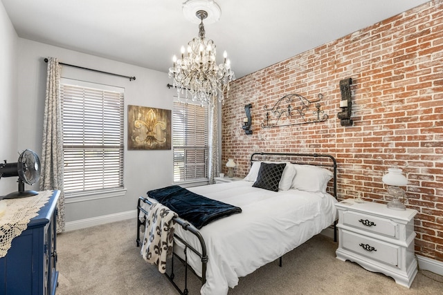 bedroom with baseboards, a chandelier, light carpet, and brick wall