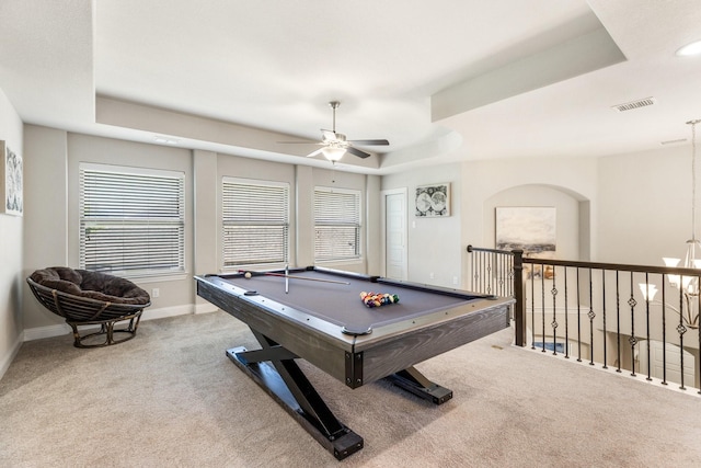 playroom featuring a tray ceiling, carpet, a ceiling fan, baseboards, and plenty of natural light
