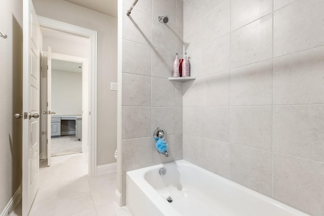 bathroom featuring  shower combination, tile patterned flooring, baseboards, and toilet