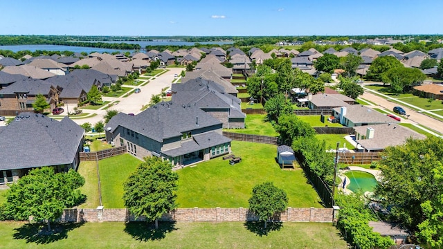 aerial view of residential area with a nearby body of water