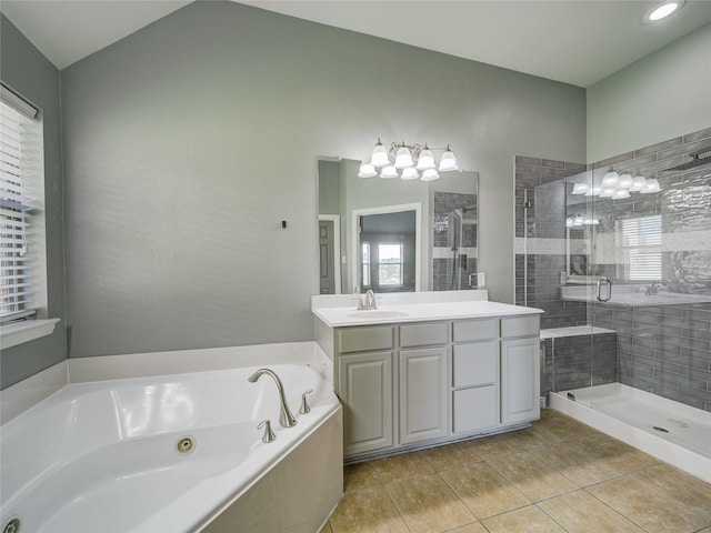 full bathroom featuring a stall shower, tile patterned flooring, a tub with jets, and vanity