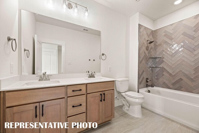 full bathroom with toilet, double vanity, and bathtub / shower combination