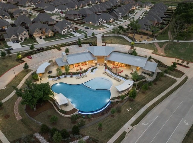view of property location featuring nearby suburban area and a pool area