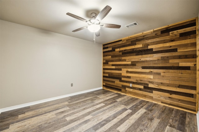 182 Willowcreek Ln, Rockwall, TX 75032 - spare room with ceiling fan, wood finished floors, wooden walls, and baseboards