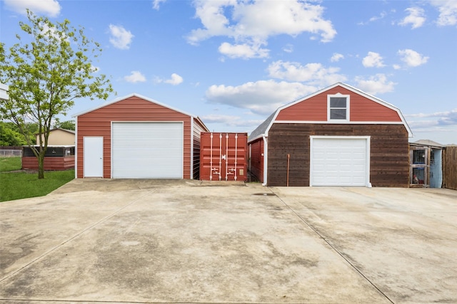 182 Willowcreek Ln, Rockwall, TX 75032 - garage with a detached garage, concrete driveway, and fence