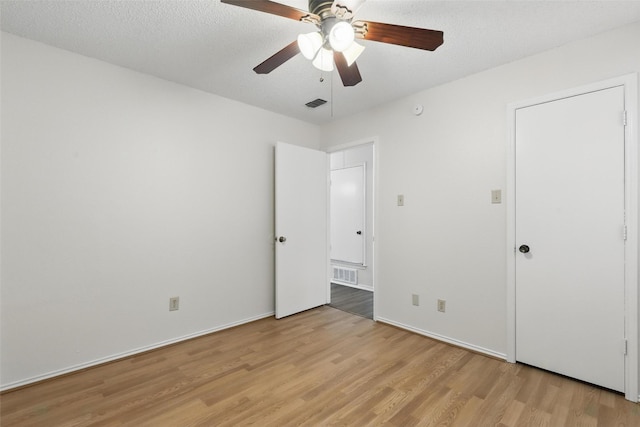 1021 Irene St, Burleson, TX 76028 - unfurnished bedroom with light wood-style flooring, ceiling fan, and baseboards