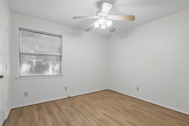 1021 Irene St, Burleson, TX 76028 - empty room featuring light wood-style floors, ceiling fan, baseboards, and a textured ceiling