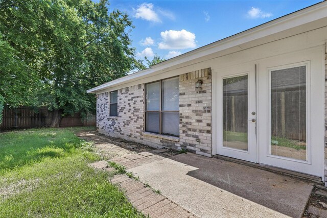 1021 Irene St, Burleson, TX 76028 - back of house with brick siding, french doors, and a patio