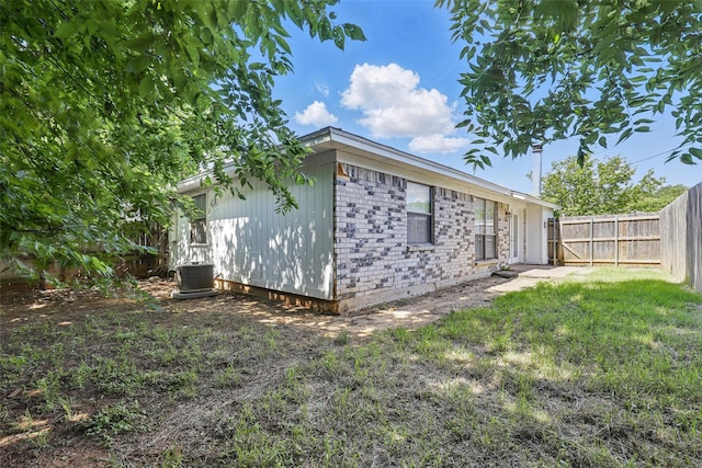 1021 Irene St, Burleson, TX 76028 - view of property exterior with cooling unit and brick siding
