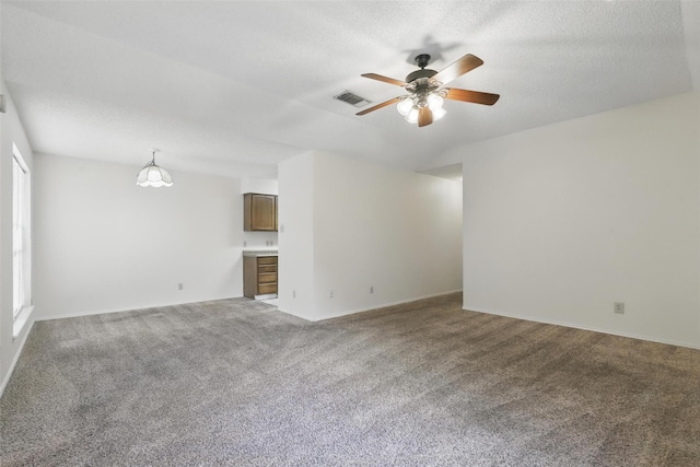 1021 Irene St, Burleson, TX 76028 - unfurnished living room featuring carpet, a ceiling fan, baseboards, and a textured ceiling