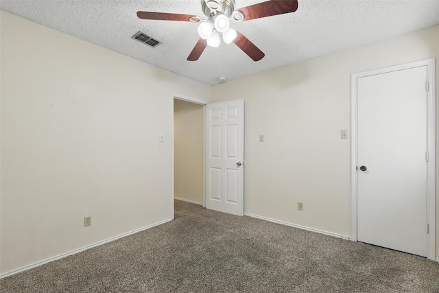 1021 Irene St, Burleson, TX 76028 - unfurnished bedroom featuring carpet floors, a textured ceiling, a ceiling fan, and baseboards