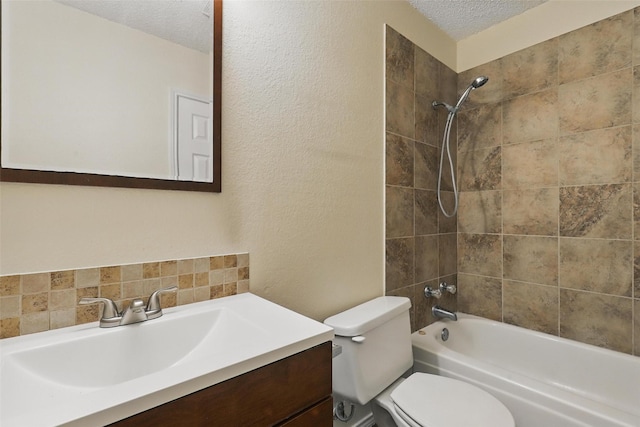 1021 Irene St, Burleson, TX 76028 - bathroom featuring a textured ceiling, toilet, tub / shower combination, vanity, and a textured wall