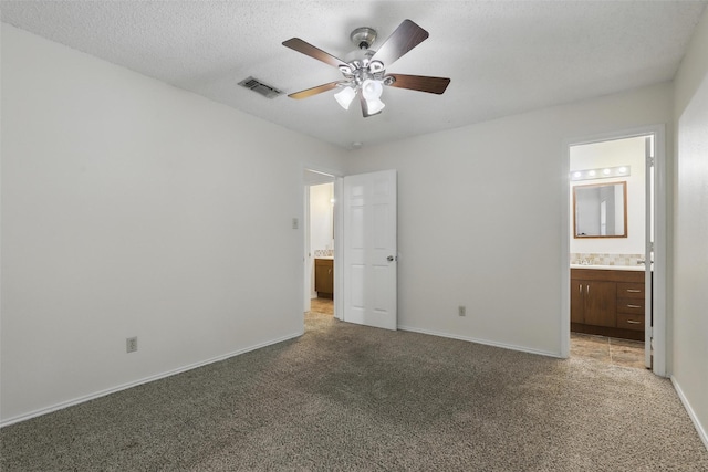 1021 Irene St, Burleson, TX 76028 - unfurnished bedroom featuring light colored carpet, connected bathroom, baseboards, and ceiling fan