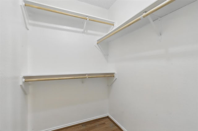 1021 Irene St, Burleson, TX 76028 - spacious closet featuring wood finished floors