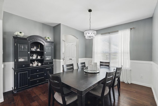 3200 Hawks View Ln, Denton, TX 76208 - dining room with dark wood finished floors, arched walkways, and a chandelier