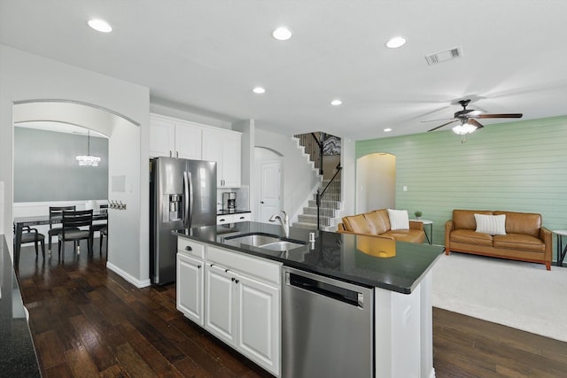 3200 Hawks View Ln, Denton, TX 76208 - kitchen with appliances with stainless steel finishes, arched walkways, dark countertops, and recessed lighting