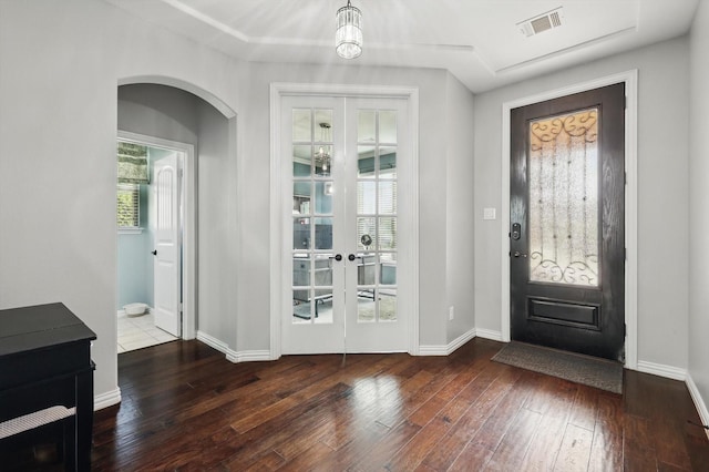 3200 Hawks View Ln, Denton, TX 76208 - foyer entrance featuring french doors, wood-type flooring, healthy amount of natural light, and arched walkways