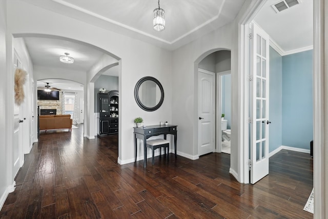 3200 Hawks View Ln, Denton, TX 76208 - entryway featuring dark wood-type flooring, a fireplace, and arched walkways