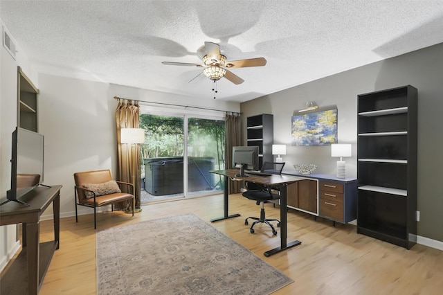 1738 Northaven Ct, Arlington, TX 76012 - office with ceiling fan, light wood-style floors, a textured ceiling, and baseboards
