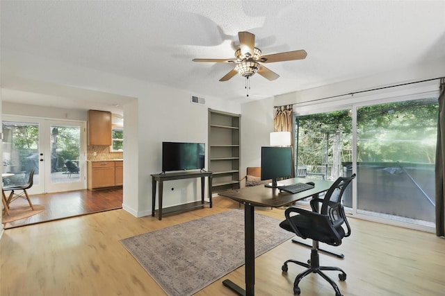 1738 Northaven Ct, Arlington, TX 76012 - office space with a ceiling fan, healthy amount of natural light, light wood-style floors, and a textured ceiling