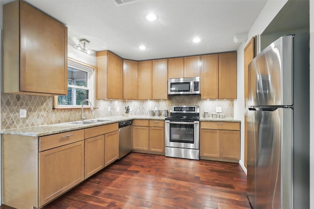 1738 Northaven Ct, Arlington, TX 76012 - kitchen with stainless steel appliances, a sink, dark wood finished floors, backsplash, and light stone counters