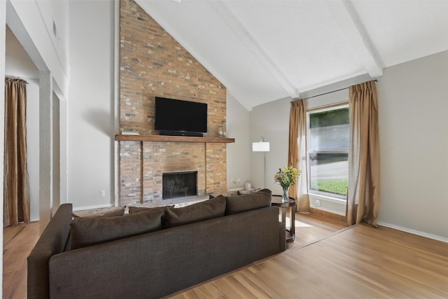 1738 Northaven Ct, Arlington, TX 76012 - living room featuring light wood-style floors, a fireplace, beamed ceiling, baseboards, and high vaulted ceiling