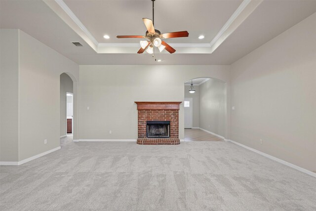 6328 Pinionpark Way, Fort Worth, TX 76179 - unfurnished living room with arched walkways, a tray ceiling, ceiling fan, ornamental molding, and recessed lighting