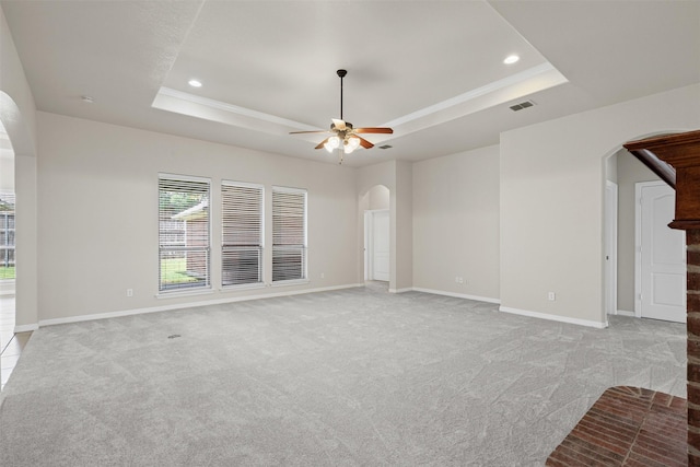6328 Pinionpark Way, Fort Worth, TX 76179 - empty room with arched walkways, a raised ceiling, light colored carpet, and recessed lighting
